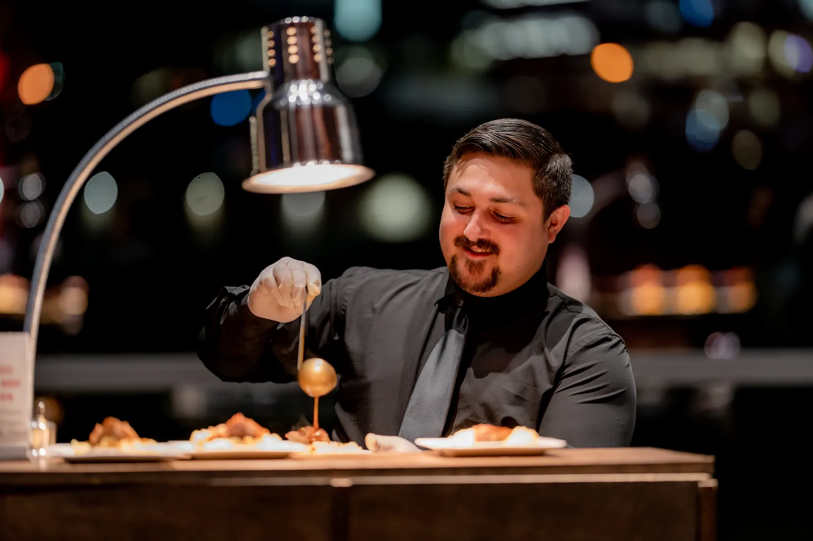 A G&nbsp;Texas chef plating under the pass