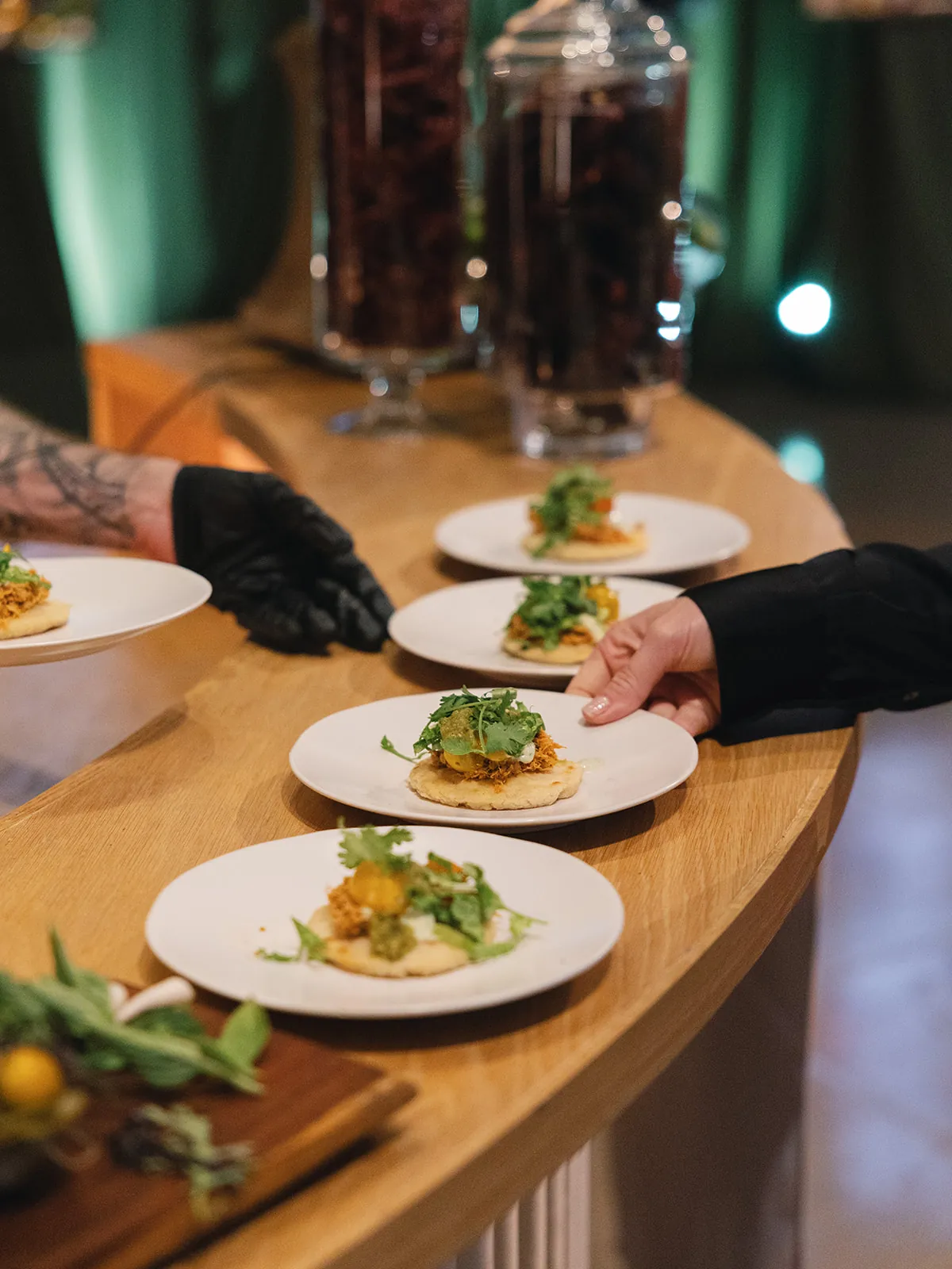 A server presenting plated courses