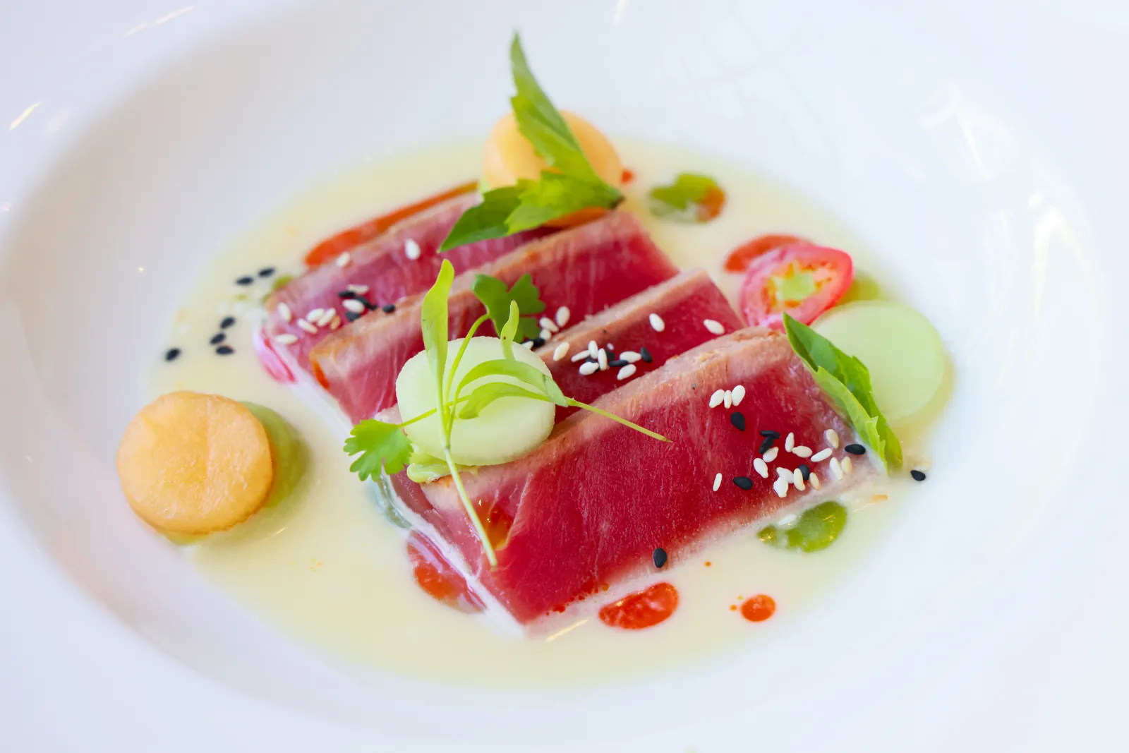 Seared tuna plated with microgreens